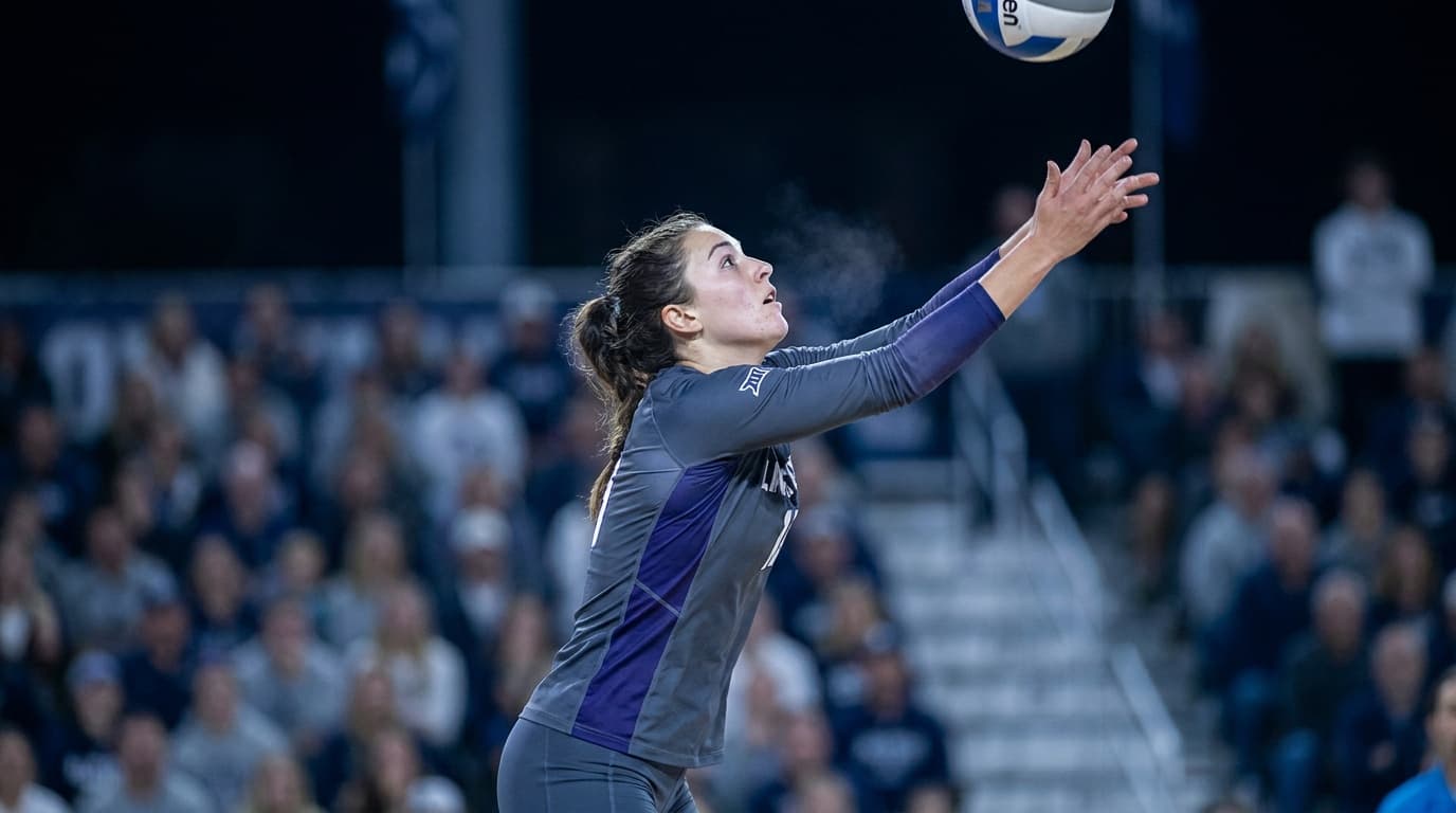 An athlete frozen mid-action under stadium light