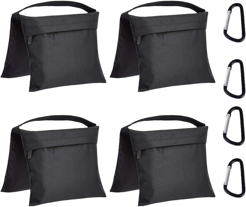 Four black Amazon Basics photography sandbags with carabiner clips