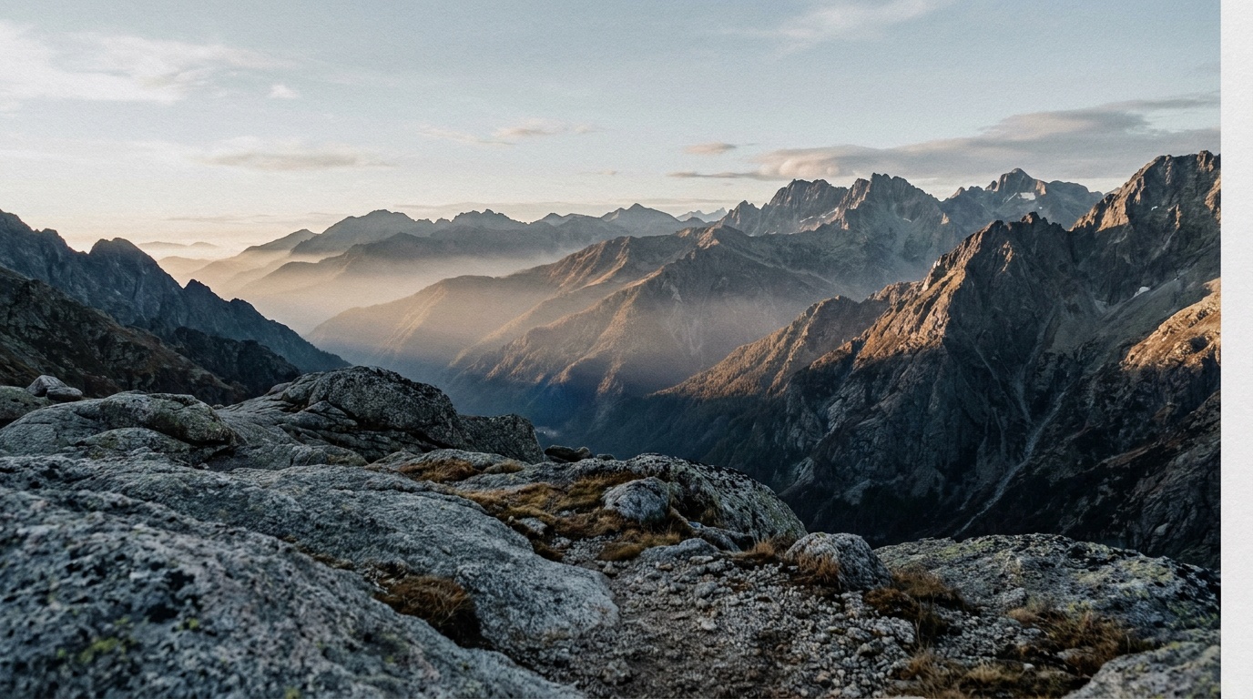 A wide vista sharp from the foreground rocks all the way to distant peaks, shot stopped down for full depth of field