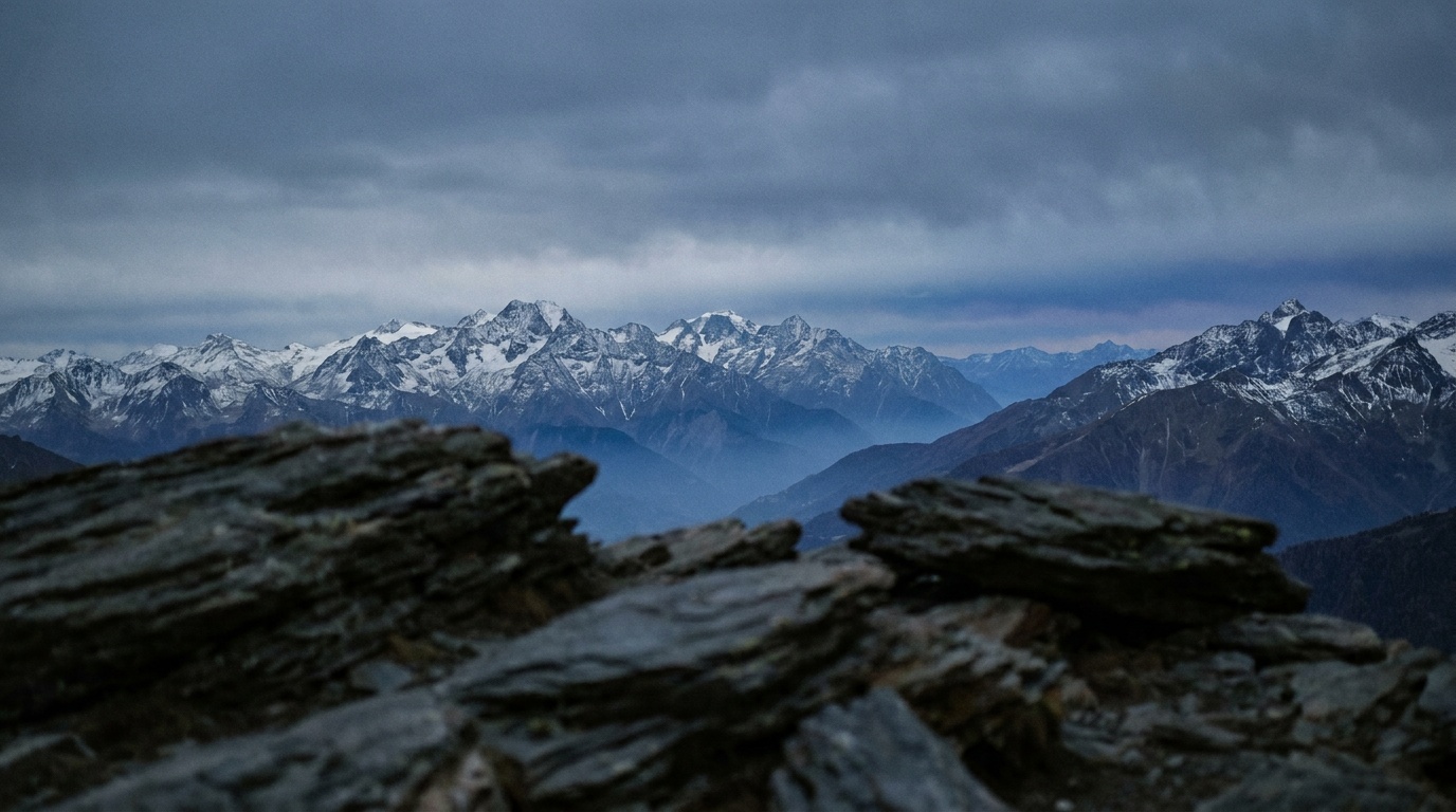 A landscape focused on infinity where the distant mountains are sharp but the near foreground rocks are visibly soft